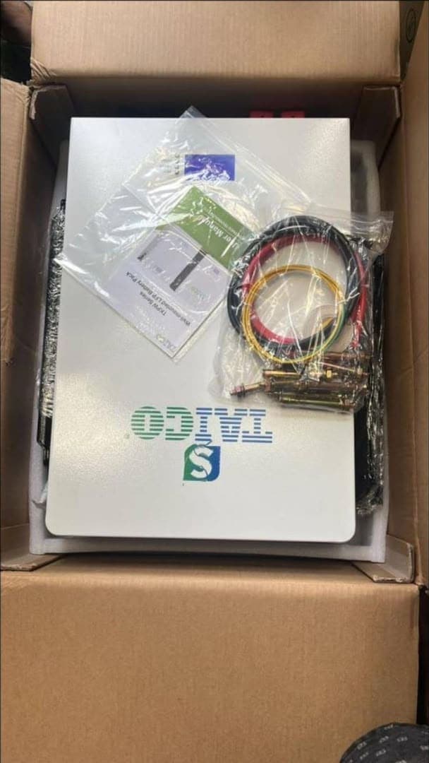 Taico 5kWh 24V wall-mounted lithium battery in its carton with cables