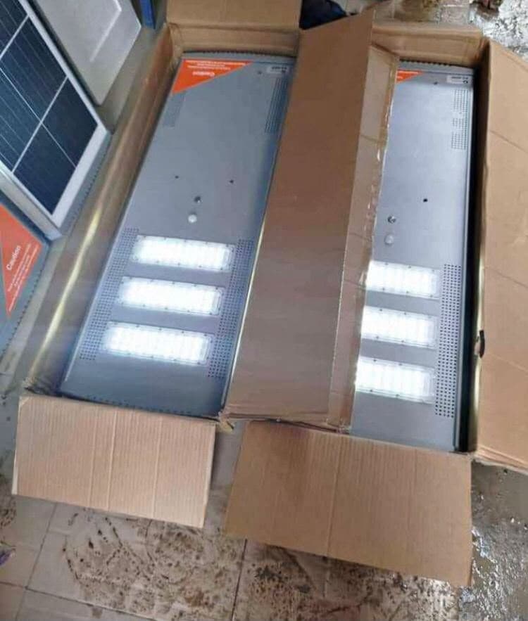Two Felicity P2 60W all-in-one solar street lights switched on in their carton